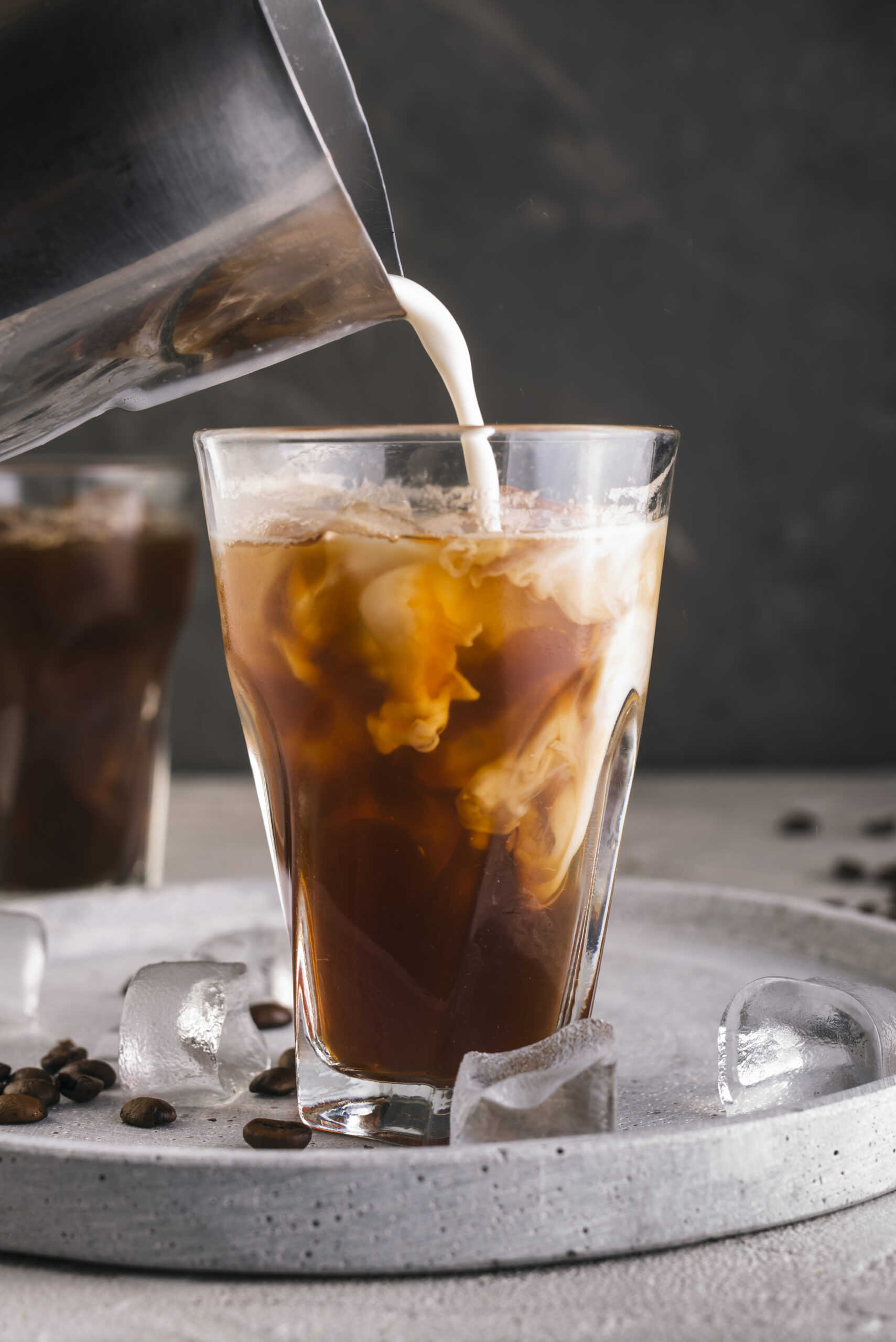 slow milk pouring coffee